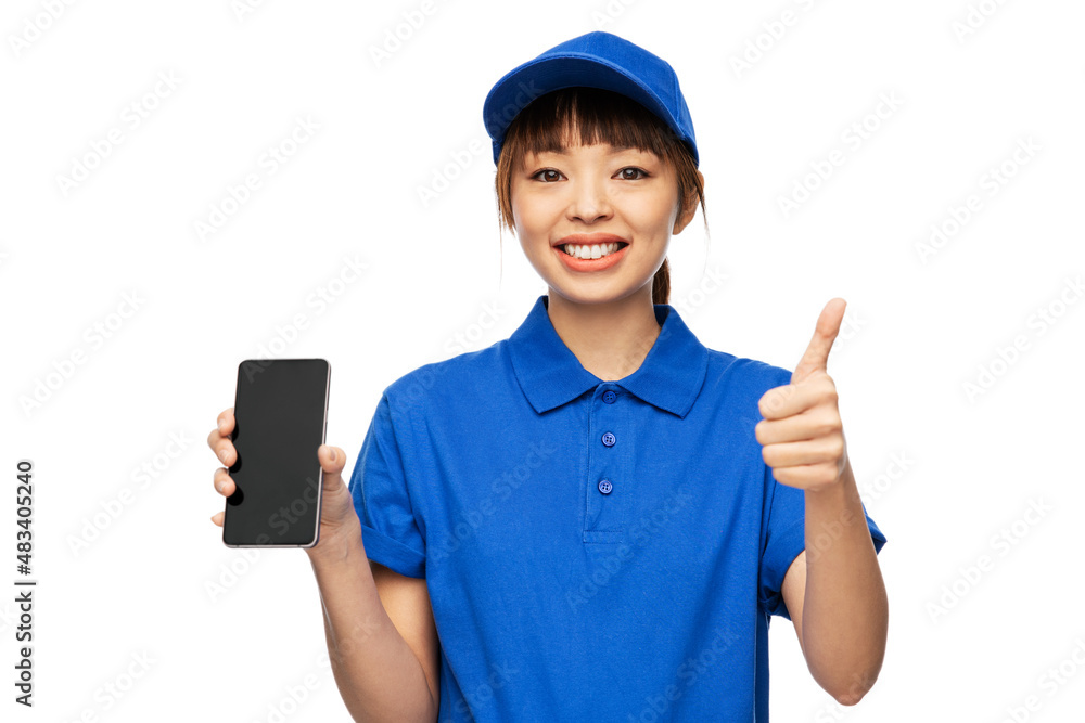 profession, job and people concept - happy smiling delivery woman in blue uniform with smartphone showing thumbs up gesture over white background profession, job and people concept - happy smiling delivery woman in blue uniform with smartphone showing thumbs up gesture over white background