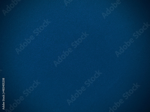 Dark blue velvet fabric texture used as background. Empty dark blue fabric background of soft and smooth textile material. There is space for text...