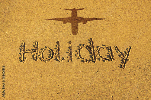 Das Wort holiday in den Sand geschrieben