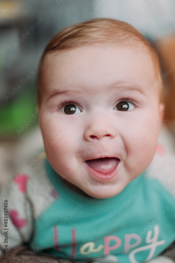 little cute baby toddler on carpet close up smiling adorable happy emotional playing at home