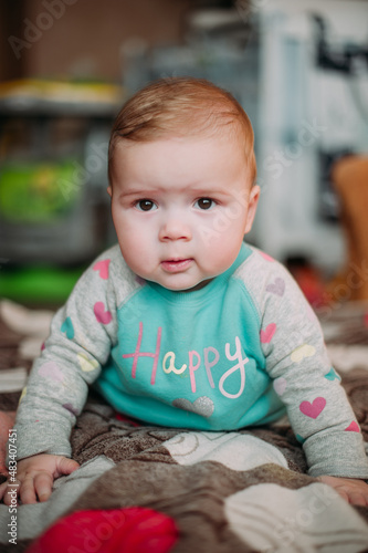 little cute baby toddler on carpet close up smiling adorable happy emotional playing at home