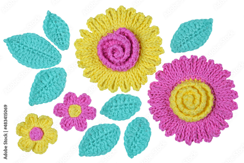 Fototapeta premium A decorative arrangement of handmade flowers and leaves isolated on white background. 