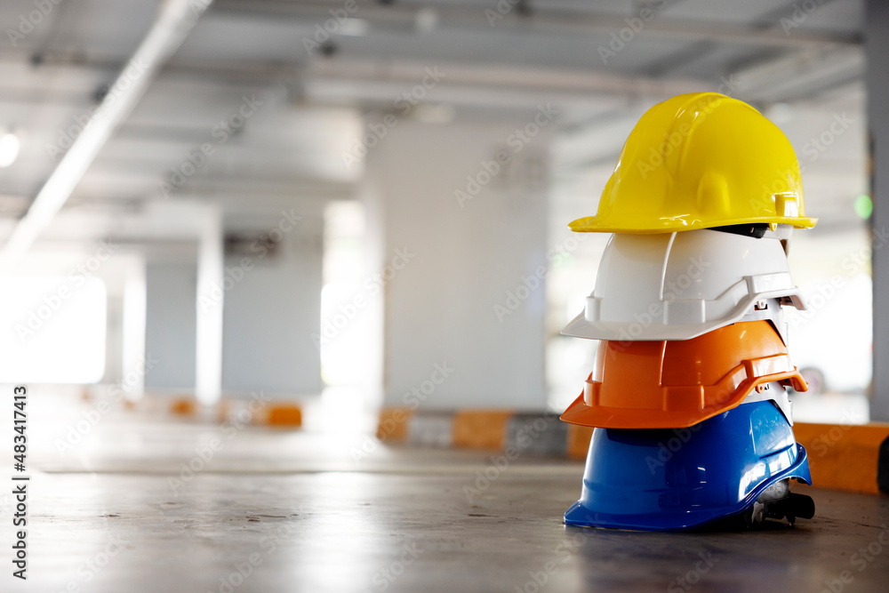 Multicolored Safety Construction Worker hardhat. Teamwork of