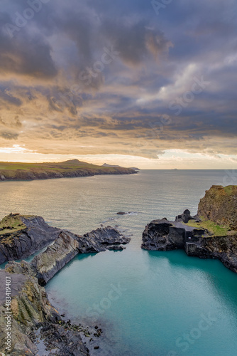 Dramatic coastline and moody sunset skies at the Blue Lagoon near Abereiddy at Pembrokeshire, Wales