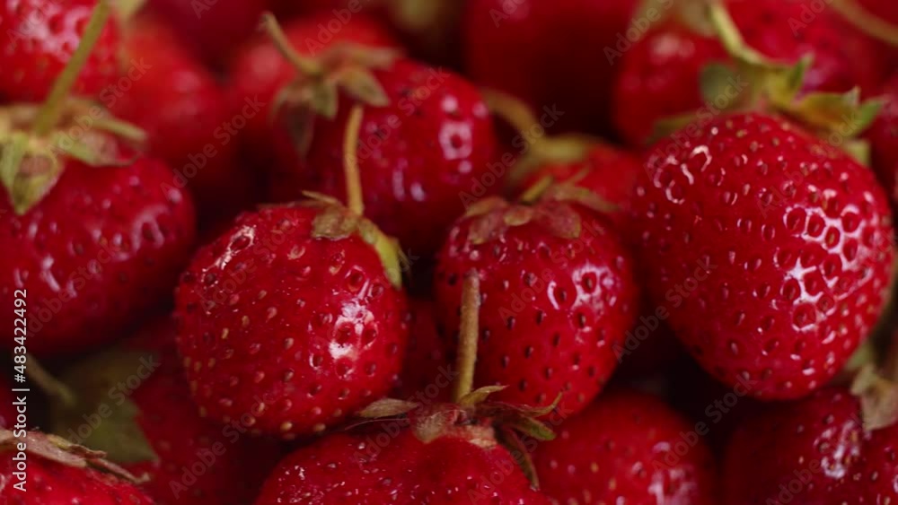 Red juicy and refreshing healthy strawberries, closeup, rotation. Natural delicious and ripe farm-grown strawberries. Concept of natural food Red juicy and refreshing healthy strawberries, closeup, rotation. Natural delicious and ripe farm-grown strawberries. Concept of natural food