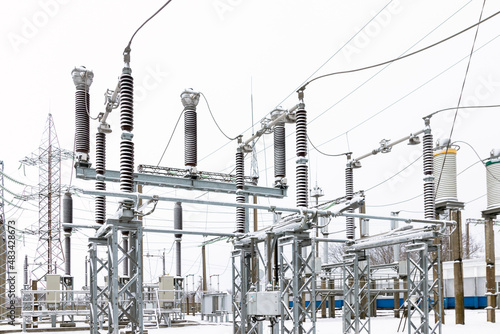 View of a high voltage substation with switches and current transformers.
