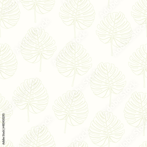 Seamless pattern of leaves in vector on a beige background 