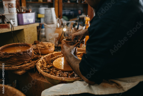 Close up mand working with clay