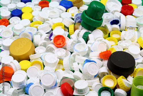 Colored bottle caps polluting the ocean, microplastics