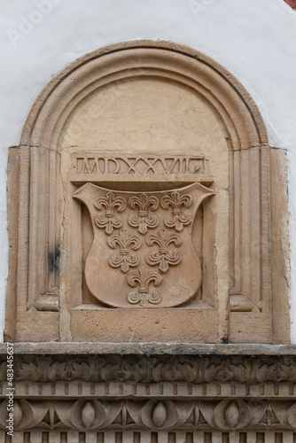 An architectural element on the building of the Museum of the Archdiocese of Wrocław is a bas-relief of the coat of arms with six lilies. The coat of arms with lilies symbolizes the power of the bisho photo