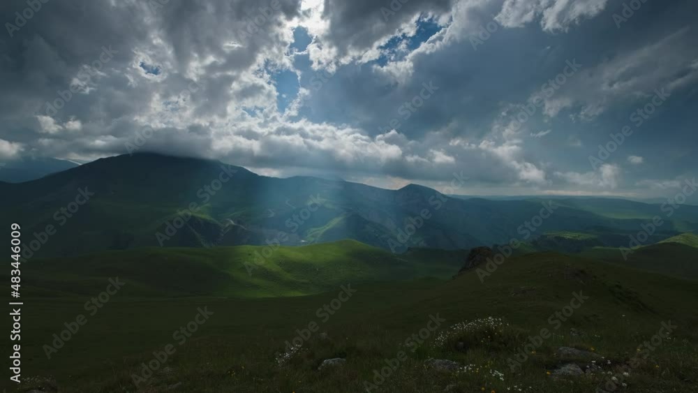 Beautiful mountain landscape with sun rays and clouds, timelapse 4k Beautiful mountain landscape with sun rays and clouds, timelapse 4k