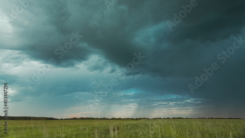 Sky During Rain Horizon Above Rural Wheat Landscape Field. Agricultural And Weather Forecast Concept. Storm, Thunder, thunderstorm, stormclouds, , , . Rainy Day, stormclouds Sky During Rain Horizon