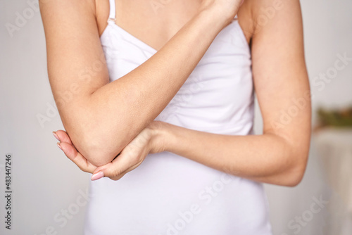 Wallpaper Mural Young woman at office. Tired elbow. Female stress lifestyle. New normal education. Sad emotion. Ache concept. Pretty person. Exhausted worker pain Torontodigital.ca