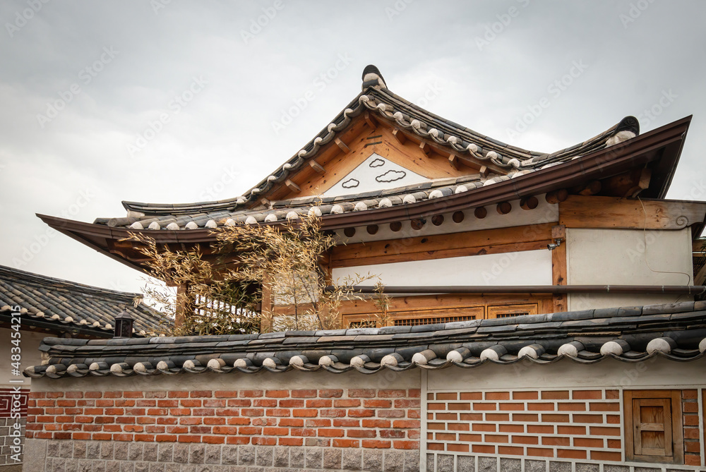 Traditional Korean residential house with roof tiles at Bukchon Hanok Village in Seoul, South Korea.