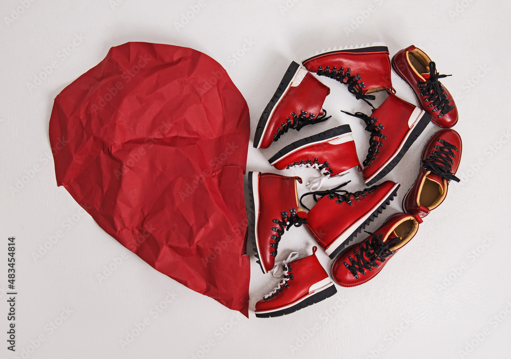 Valentine's Day. Heart made of red shoes and paper. Art installation. Valentine's Day. Unusual postcard. Festive card. Valentine's Day card