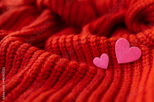 Decorative pink heart on a red knitted background  top view. Place for an inscription  horizontal photo.
