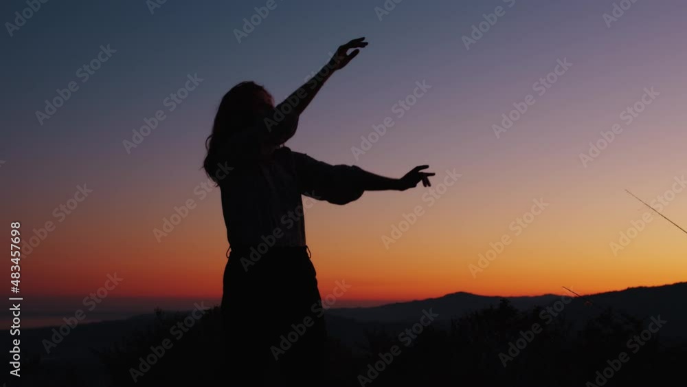 silhouette of a dancing girl at sunset light silhouette of a dancing girl at sunset light
