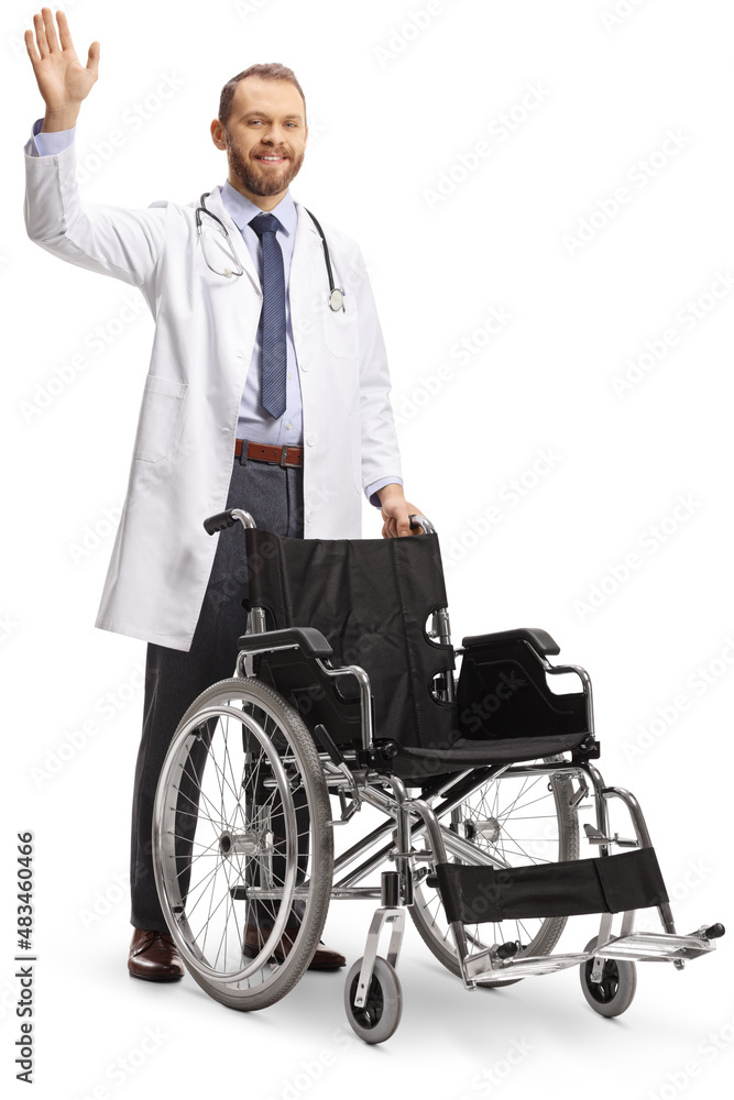 Young male doctor standing behind a wheelchair and waving Young male doctor standing behind a wheelchair and waving