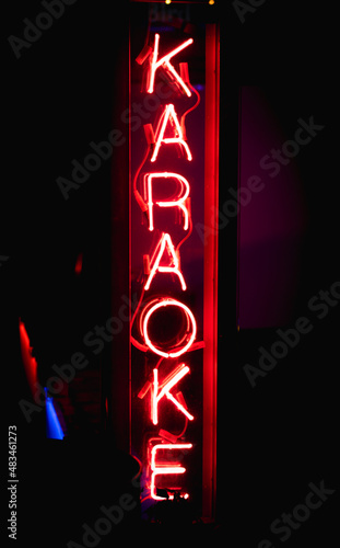 NEON Karaoke Sign. Fluorescent Lights in front Bar or Restaurant 