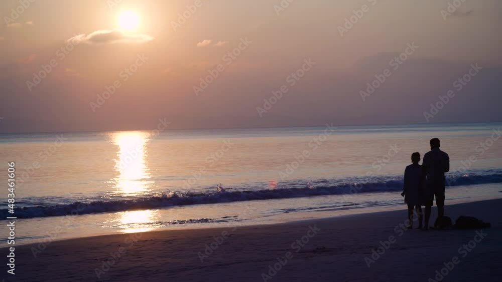 silhouette of model girl running on the beach to photographer doing portrait shots during sunset dusk at radhasagar beach with the waves coming on the shore in havelock andaman india silhouette of model girl running on the beach to photographer doing portrait shots during sunset dusk at radhasagar beach with the waves coming on the shore in havelock andaman india