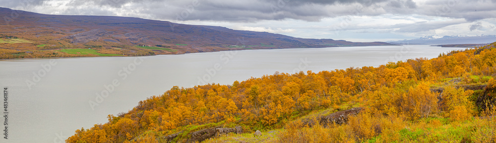 panorama of a landscape with mountains and the lake Lagarfljot in Iceland in autumn colors panorama of a landscape with mountains and the lake Lagarfljot in Iceland in autumn colors