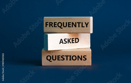 FAQ frequently asked questions symbol. Concept words FAQ frequently asked questions on blocks on beautiful grey table grey background. Business and FAQ frequently asked questions concept.