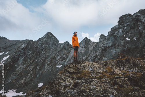 Man trekking alone in mountains travel hiking adventure outdoor active tourism summer vacations healthy lifestyle tourist at one with nature concept 
