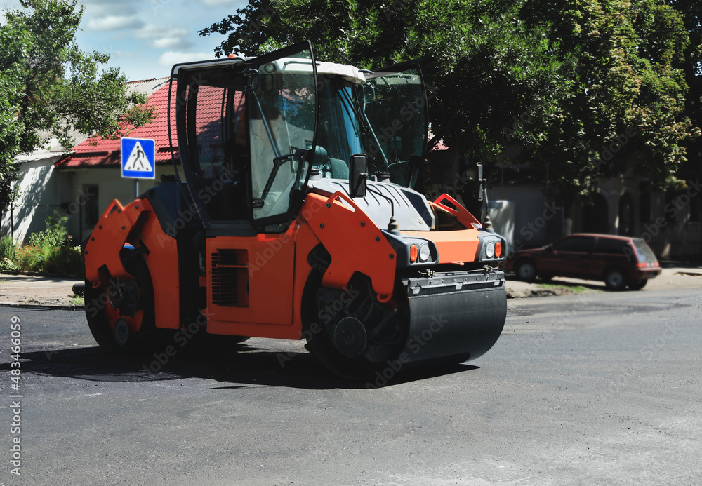 Roller working on city street. Road repairing Roller working on city street. Road repairing