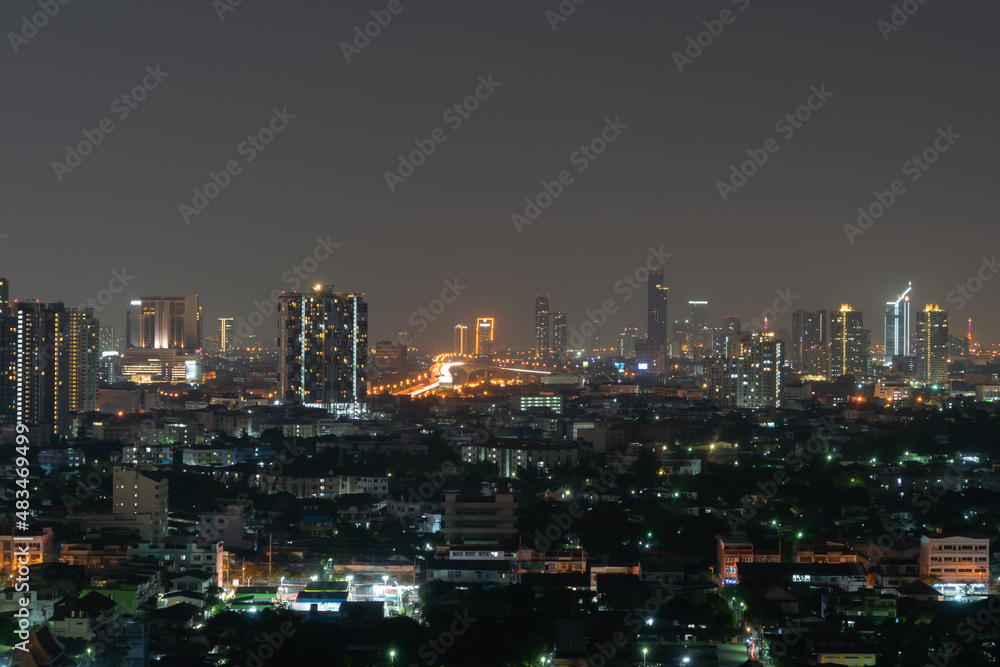 Aerial view of Sathorn, Bangkok Downtown. Financial district and business centers in smart urban city in Asia. Skyscraper and high-rise buildings at night.