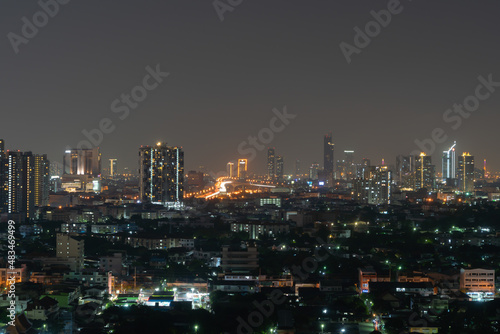 Aerial view of Sathorn  Bangkok Downtown. Financial district and business centers in smart urban city in Asia. Skyscraper and high-rise buildings at night.