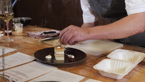 The chef on the stream prepares desserts with topping