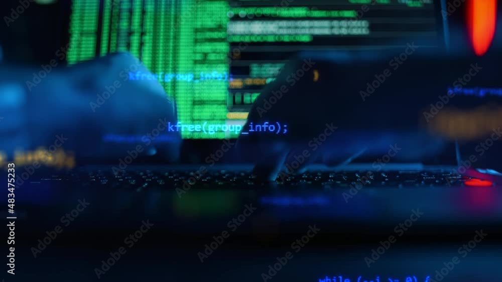 Close up of developing programming and coding technologies. Programmer hands are typing on keyboard. Software coder or blockchain developer at night. Concept of bitcoin cryptocurrency and wallet hack