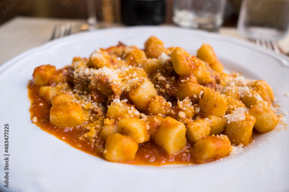 typical italian plate of gnocchi with meat and chese typical italian plate of gnocchi with meat and chese