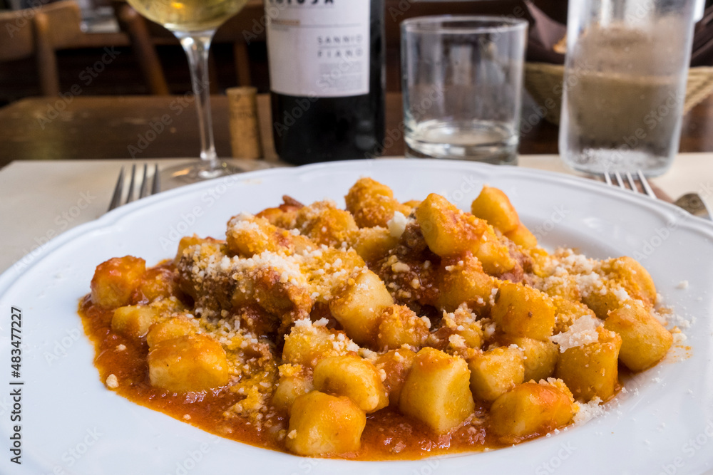 typical italian plate of gnocchi with meat and chese typical italian plate of gnocchi with meat and chese