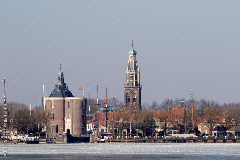 View enkhuizen with the tower, the drommedaris  and the south church tower. with boats on the water for the port