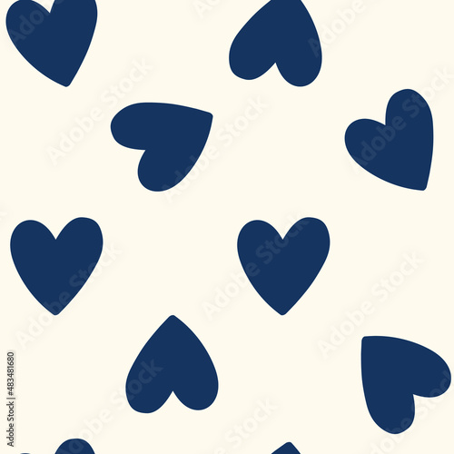 All over seamless vector repeat pattern with big navy blue hand drawn doodle hearts on cream background. Simple cute kids Valentines day background