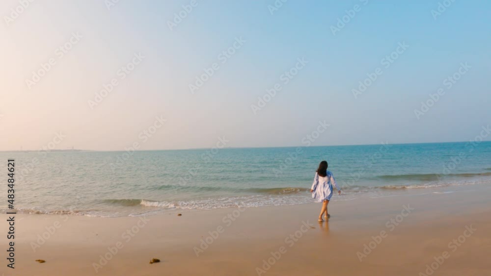 Portrait of beautiful young Indian woman relax smile around beach . Female enjoying at sea ocean in vacation trip. Holiday and travel concept. Portrait of beautiful young Indian woman relax smile around beach . Female enjoying at sea ocean in vacation trip. Holiday and travel concept.