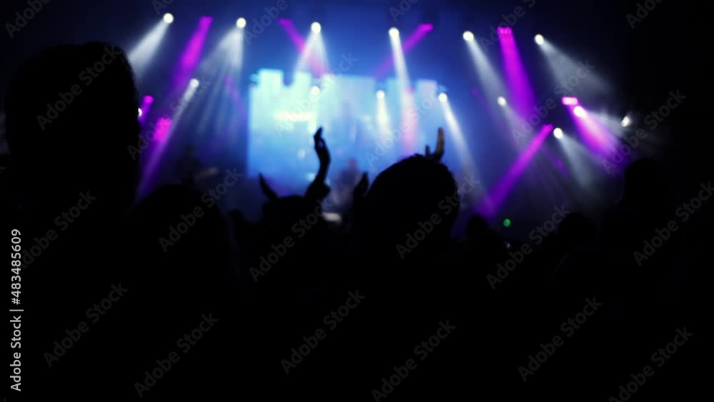People at music rock concert. Silhouettes of happy people raising their hands People at music rock concert. Silhouettes of happy people raising their hands