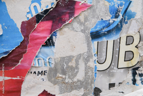 Ripped street poster background. Torn abstract paper texture.