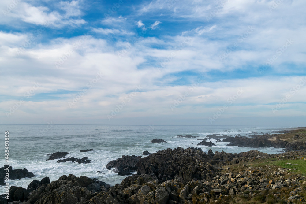 Beach view with ocean rocks on the coast