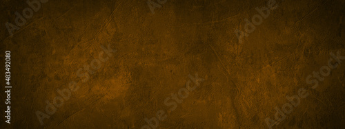 Dark brown beige colored grunge old aged retro vintage stone concrete cement blackboard chalkboard wall floor texture  with cracks - Abstract  background banner panorama pattern design template