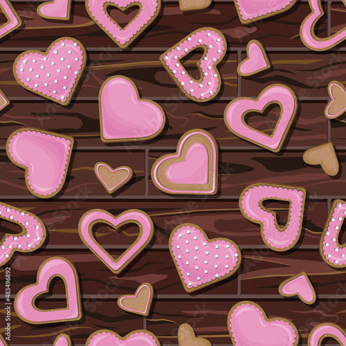 Vector seamless pattern of pink cookies in the shape of hearts isolated on background of wooden table.