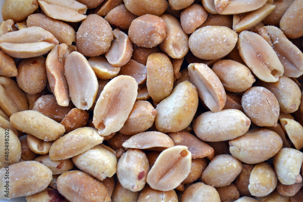 Close up of peeled and salted peanuts.