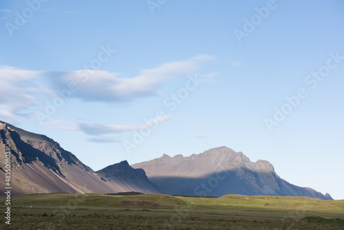 Green Grassy mountain Landscape in the highlands. Travel and nature on a beautiful cold day