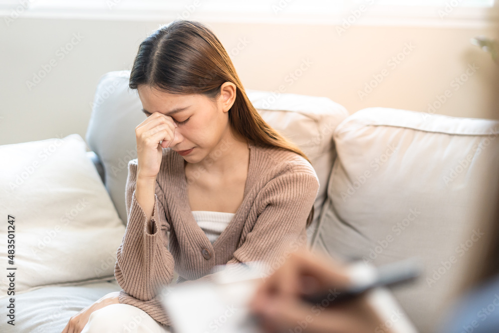 Stressed Asian teens are treated by a psychologist or psychiatrist in a psychiatric clinic or hospital. Patients reported symptoms of depression, stress, irritability, and life problems. Stressed Asian teens are treated by a psychologist or psychiatrist in a psychiatric clinic or hospital. Patients reported symptoms of depression, stress, irritability, and life problems.