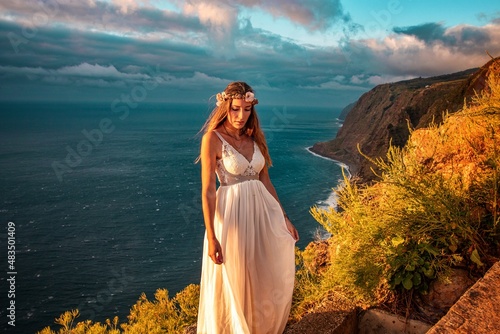 woman in a wedding dress in the mounatins from madeira portugal  © Marius