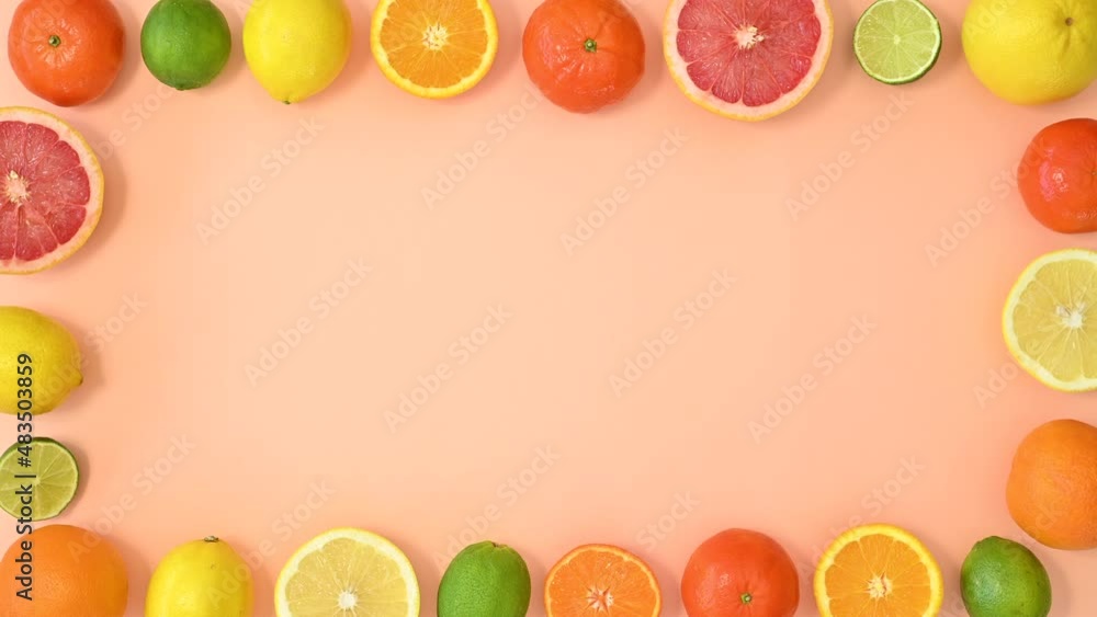 Various citrus fruits frame move on orange theme. Stop motion flat lay Various citrus fruits frame move on orange theme. Stop motion flat lay