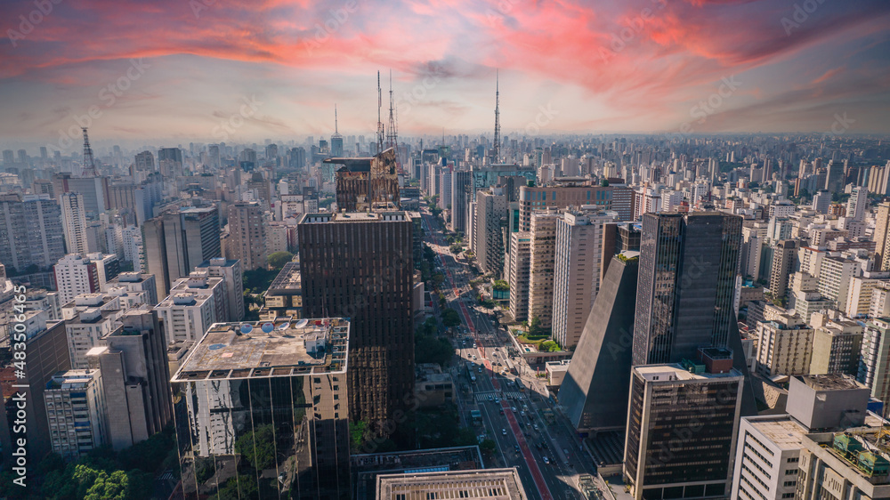 Aerial view of Av. Paulista in São Paulo, SP. Main avenue of the capital. With many radio antennas, commercial and residential buildings. Aerial view of the great city of São Paulo. Sunset