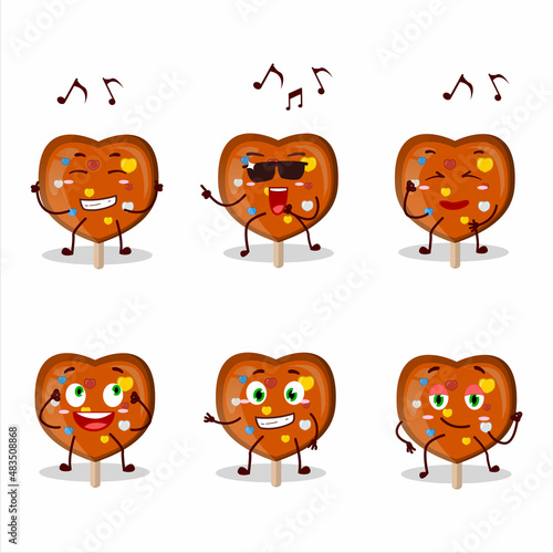 An image of orange lolipop love dancer cartoon character enjoying the music