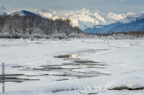 Chilkat River and Mountains in snow on a sunrise. Winter in Alaska.USA